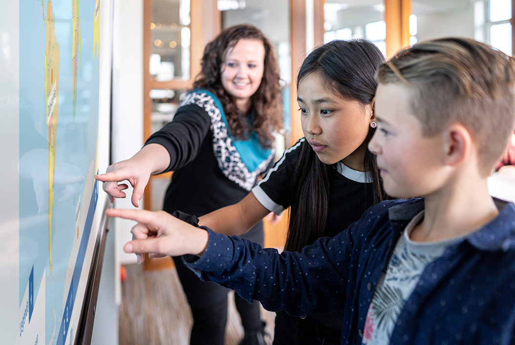 Multiple students working simultaneously on Prowise touchscreen